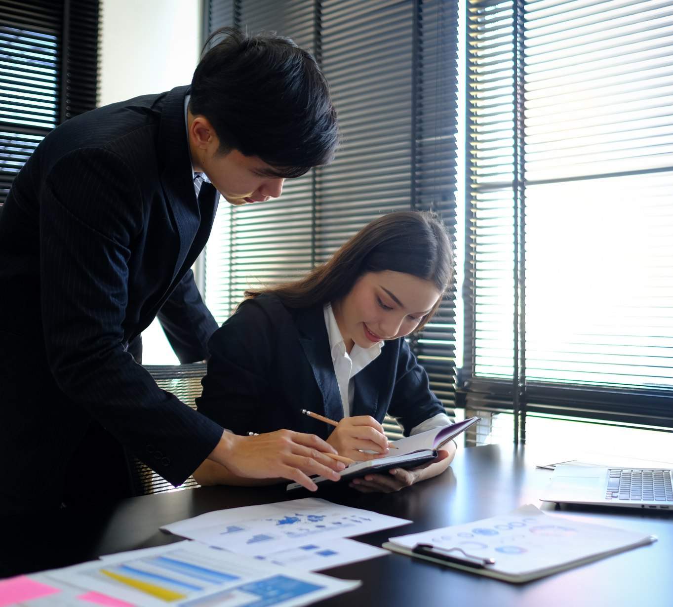 Audit team reviewing an SME's financial statements