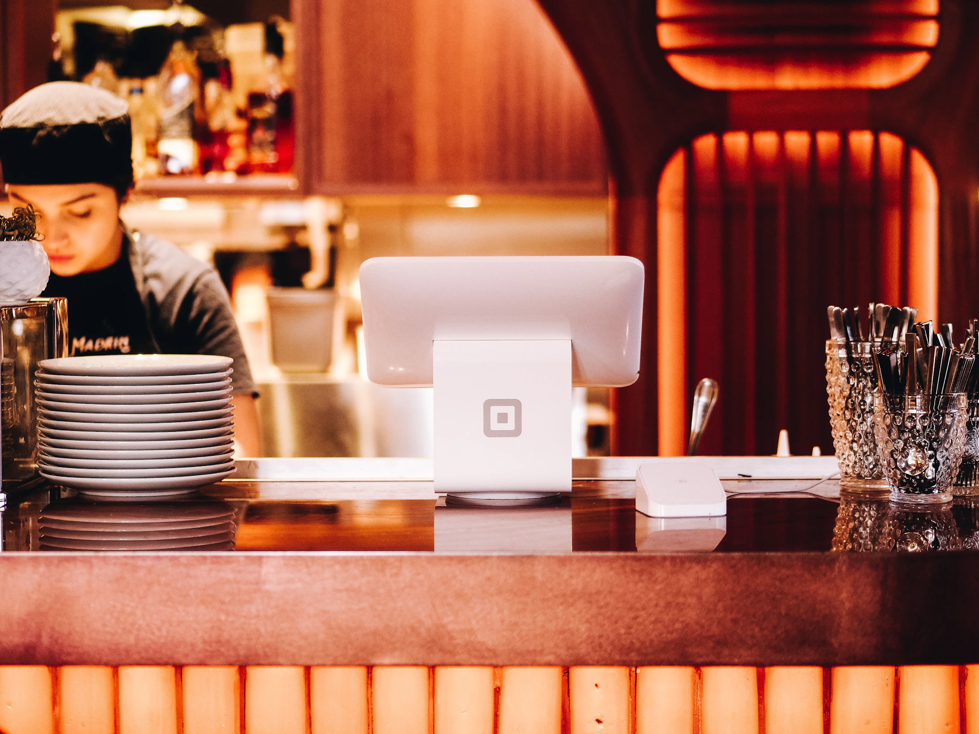 Restaurant owner at the counter after sorting out her restaurant license Malaysia approvals